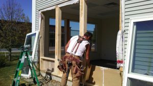 A contractor from Protech replacing a window in Northern Vermont.